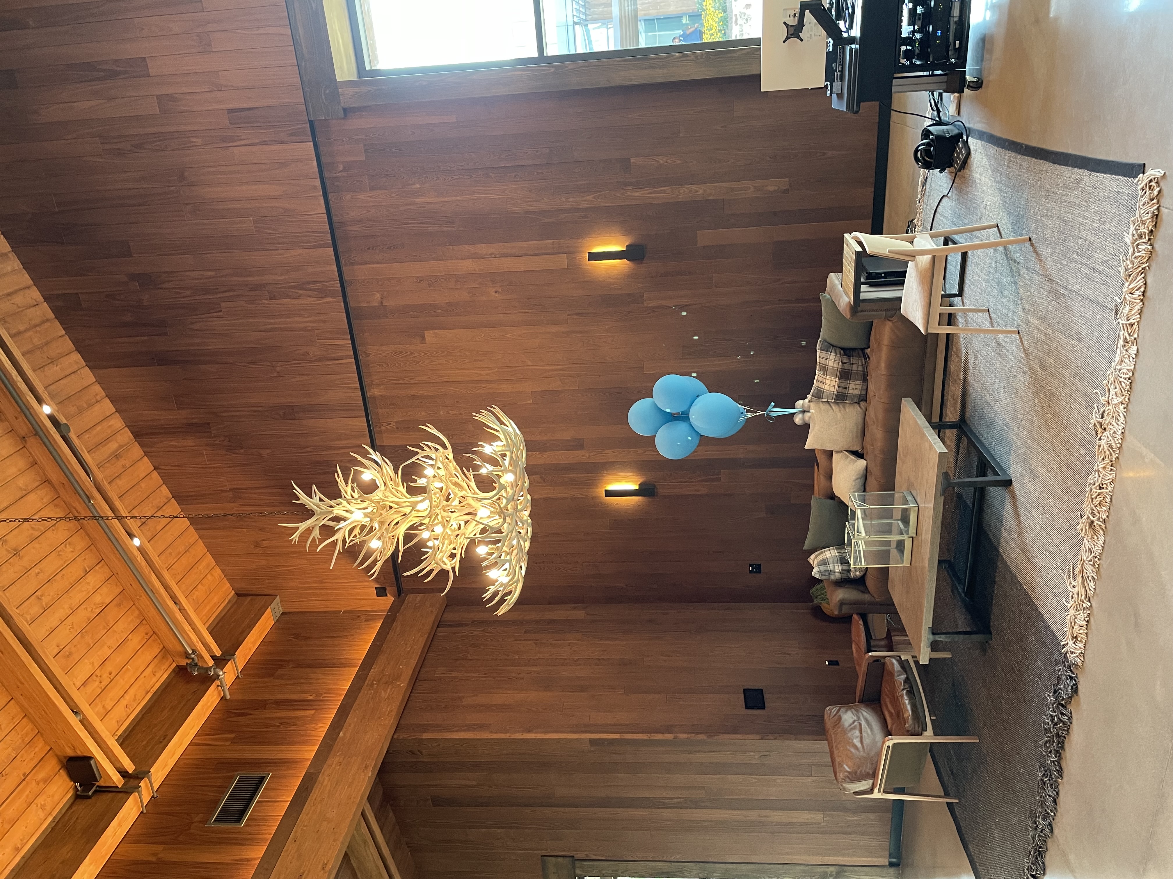 Bandwidth HQ — grand lobby with floor-to-ceiling wood paneling